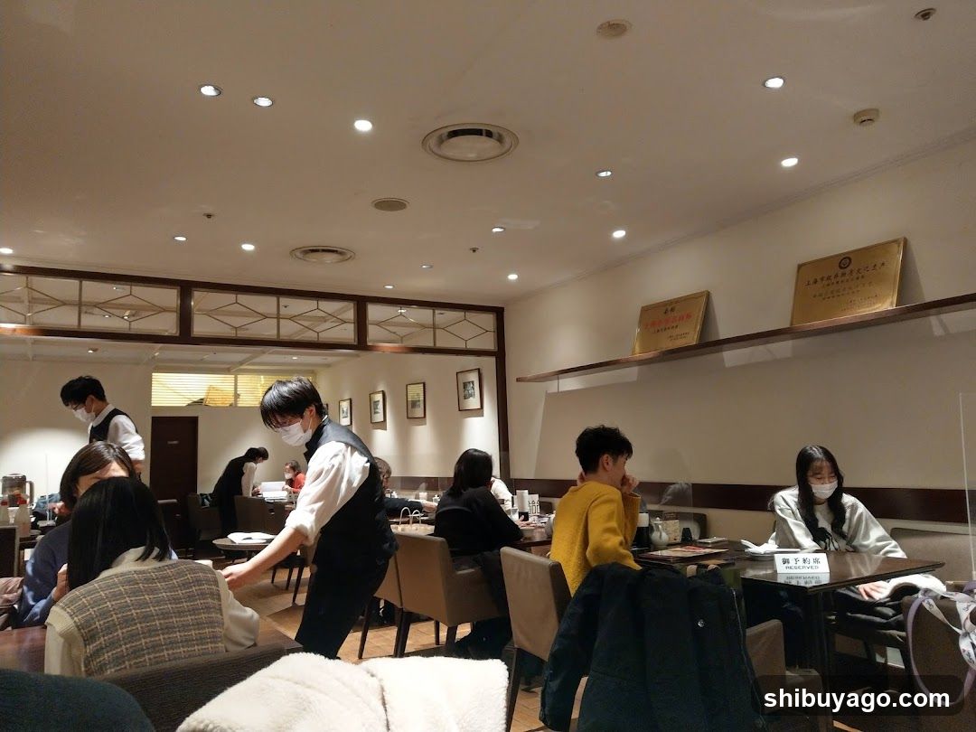 Dining Room Interior with Staff Serving
