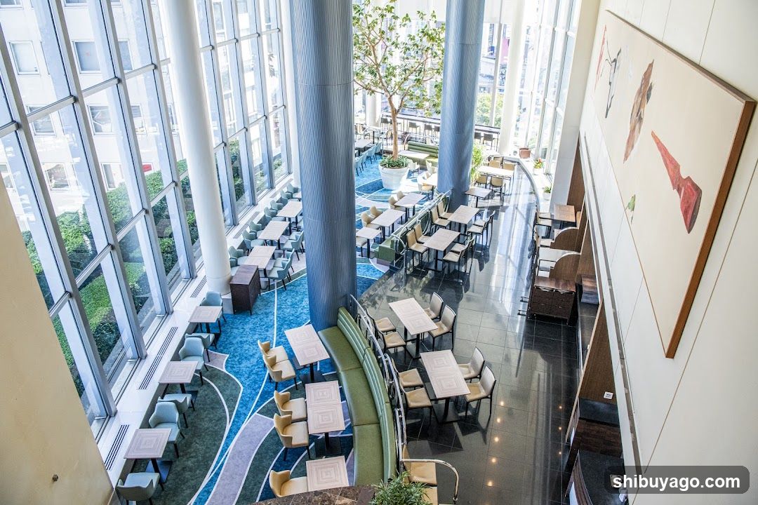 Modern Interior Dining Area with Large Windows and Artwork