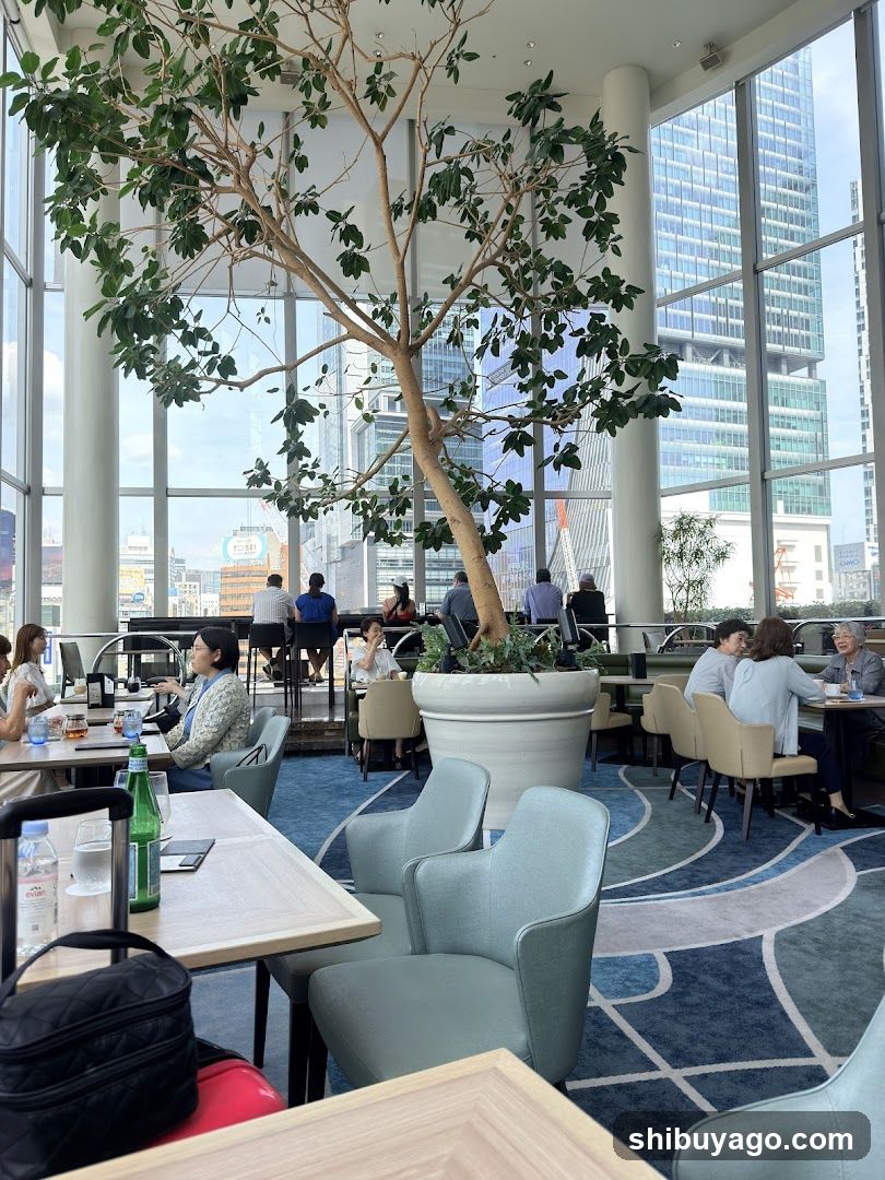Modern Interior with Large Tree and City View