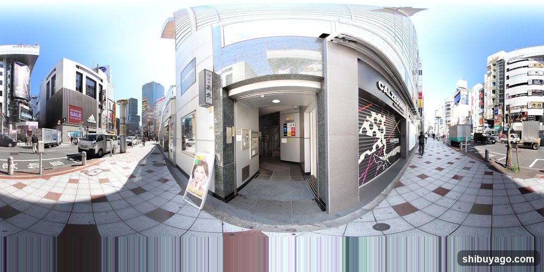 Urban Street Scene with Storefronts and Vehicles