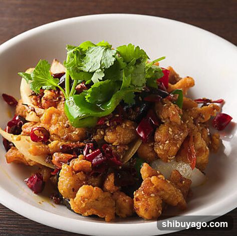 Spicy Stir-fried Chicken with Cilantro and Chili Peppers