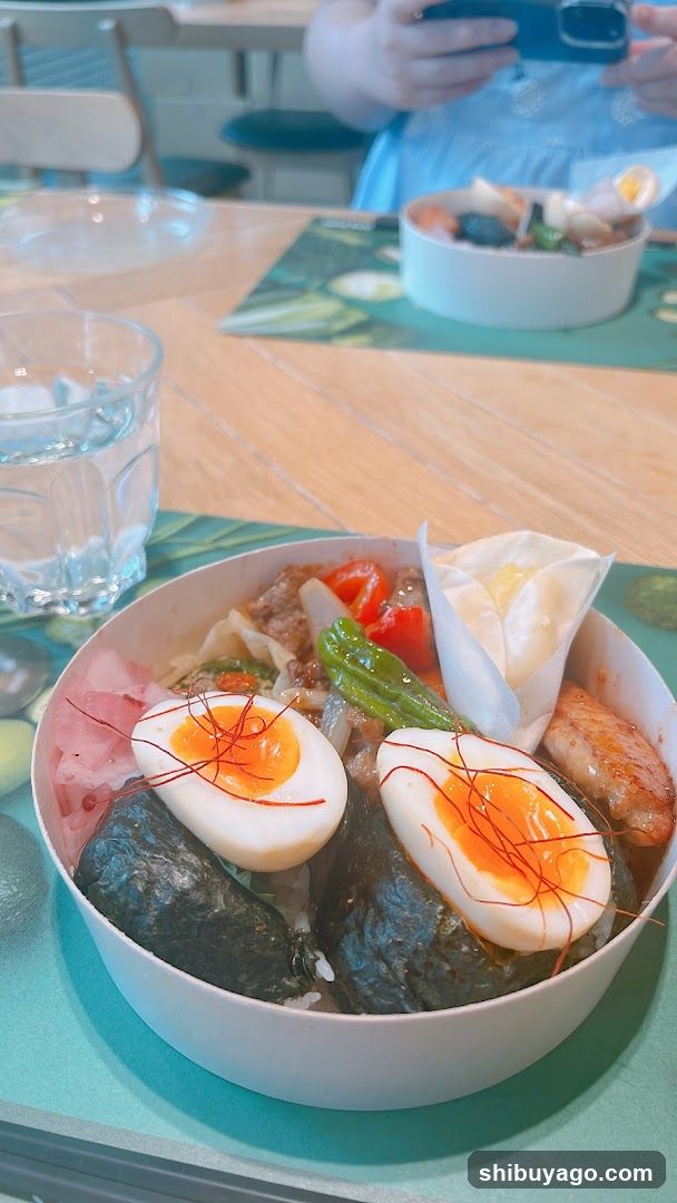 Bowl of food with egg and seaweed