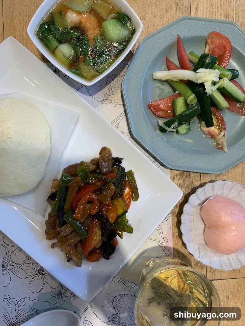 Meal Spread with Steamed Bun and Stir-fry