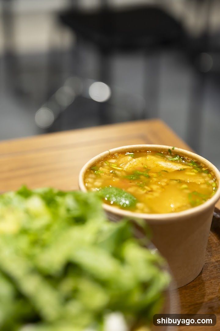 Soup and Salad on Wooden Table