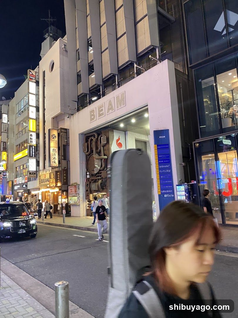 Night street scene with storefronts and pedestrians