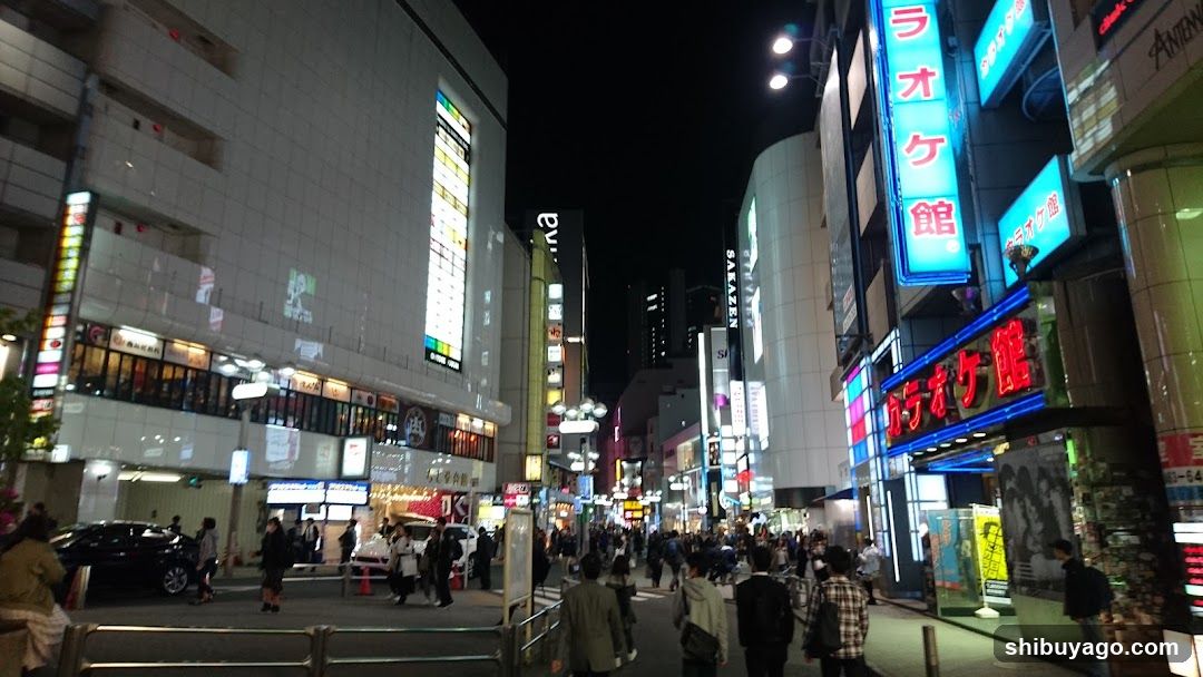 Nighttime Street Scene with Neon Signs