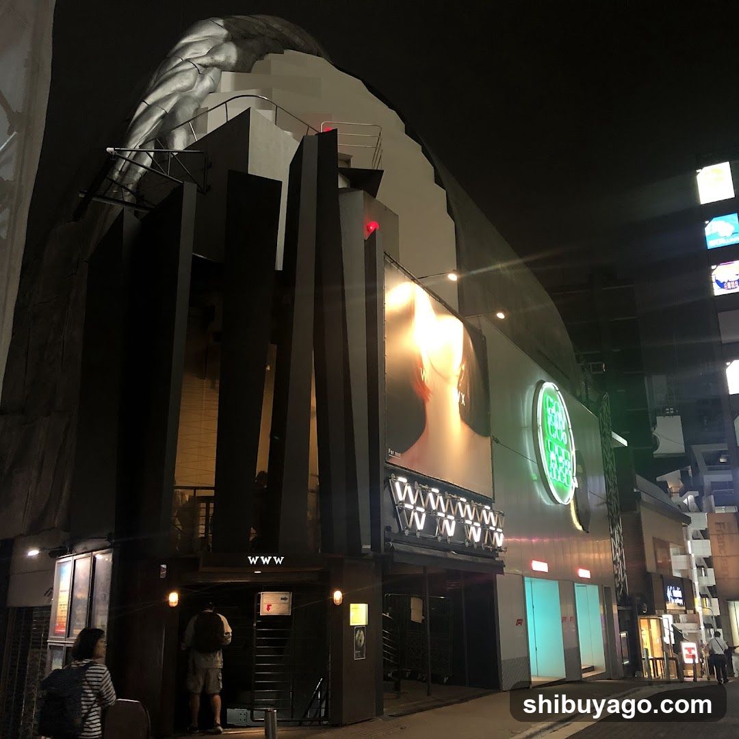Night street scene with illuminated building facade
