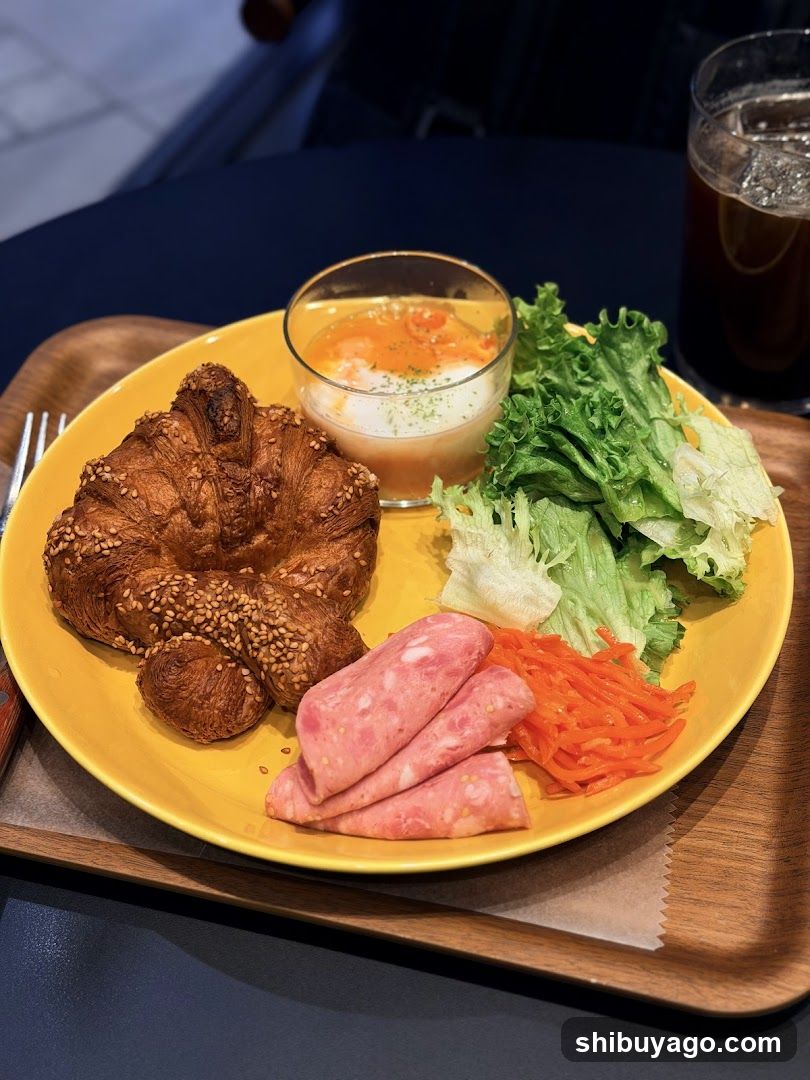 Breakfast Plate with Croissant, Ham, Lettuce and Soup