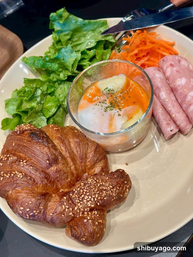 Breakfast Plate with Croissant and Sausage