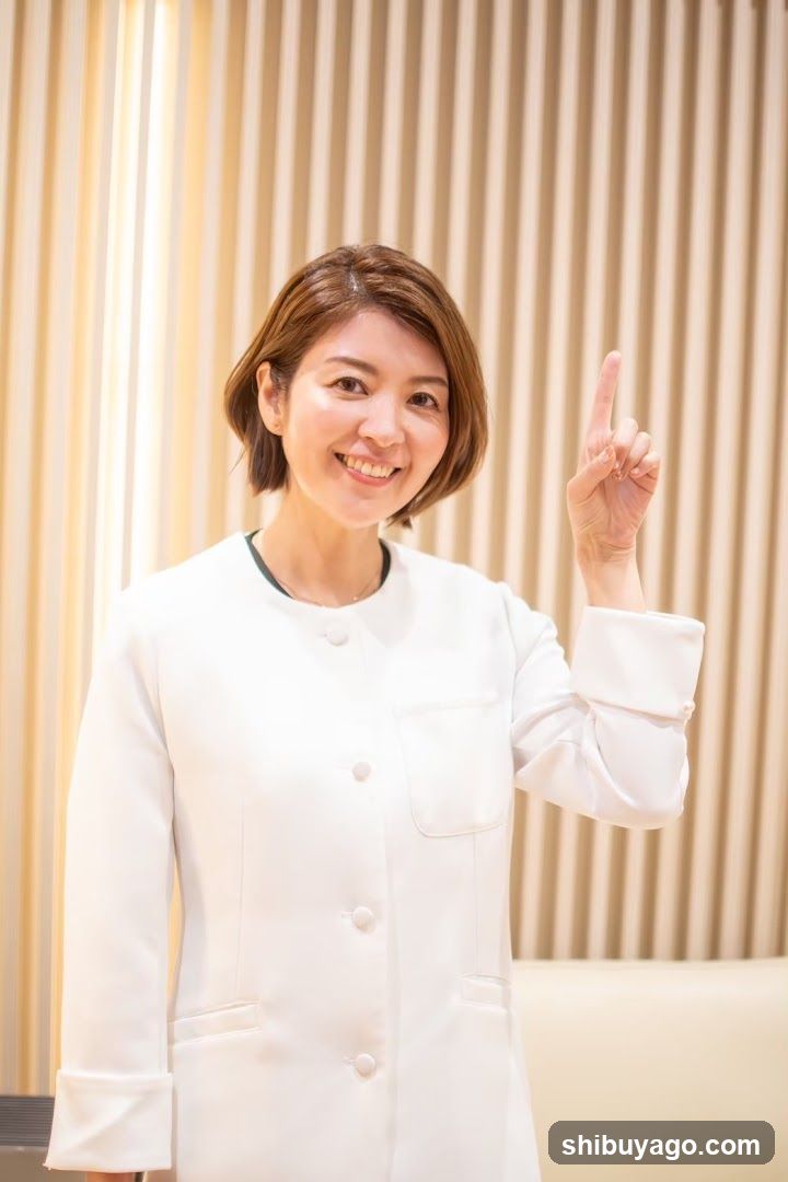 Smiling Staff Member in White Uniform