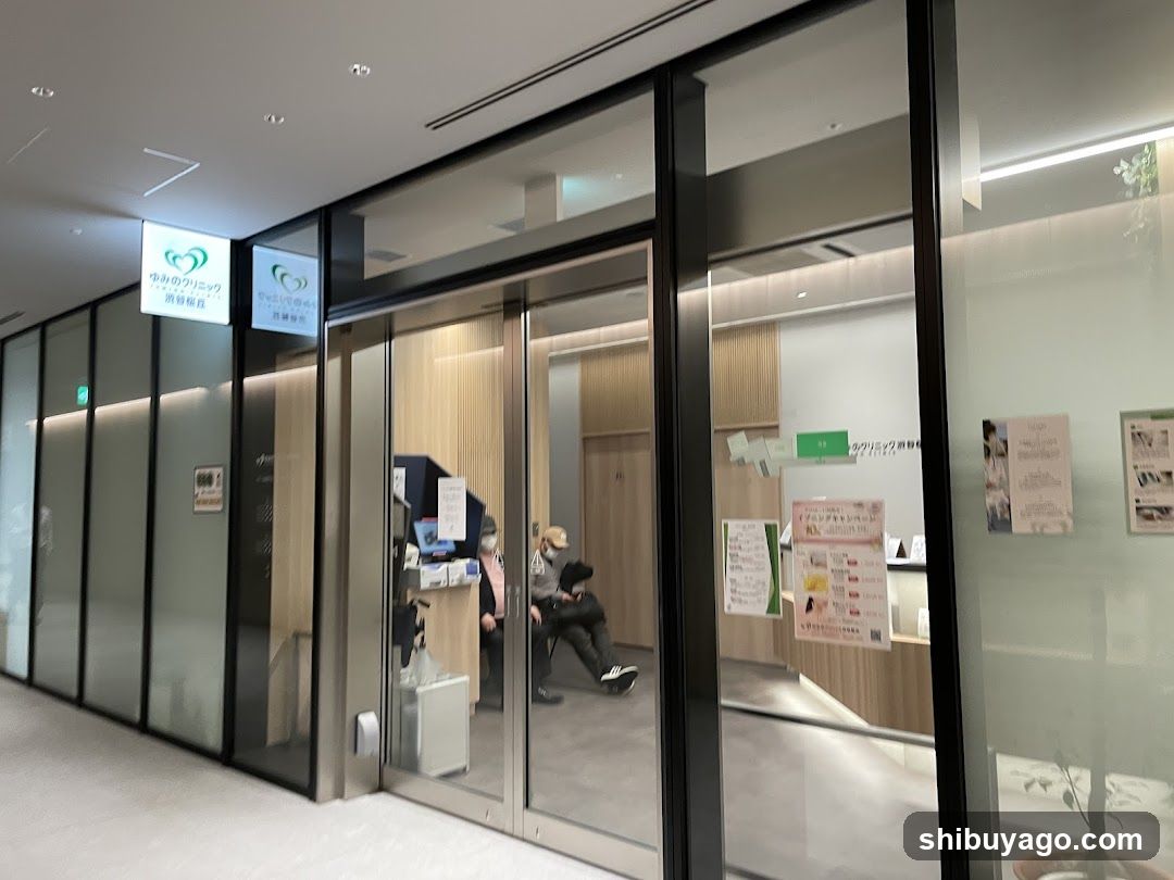 Interior of a modern reception area with glass doors and signage