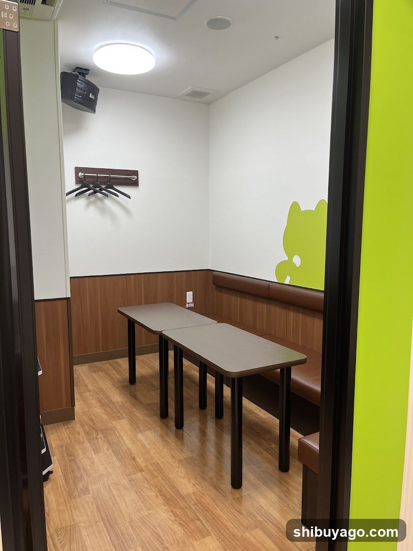 Interior of a small room with tables and benches
