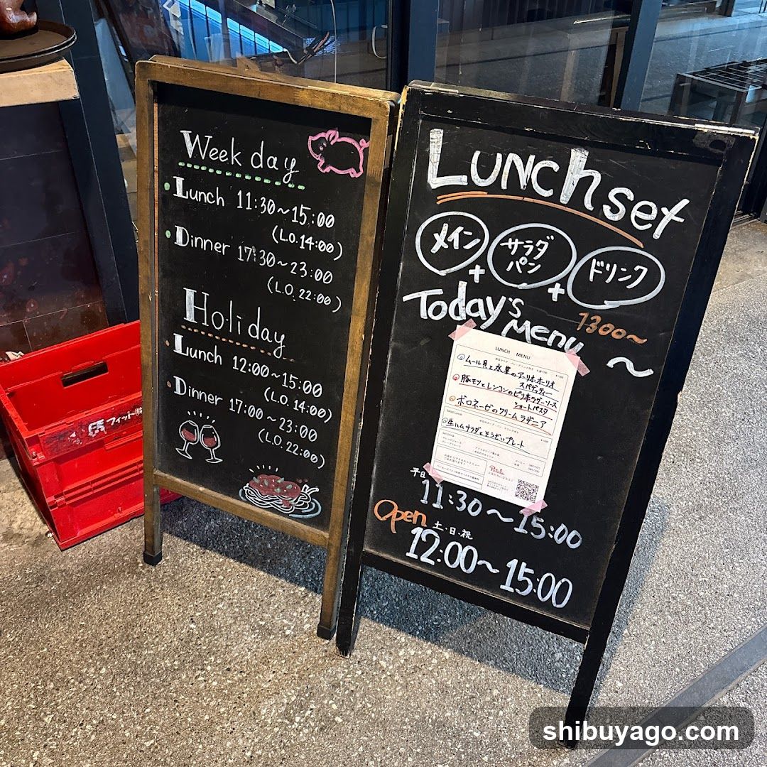 A photo of two chalkboard signs outside a restaurant.