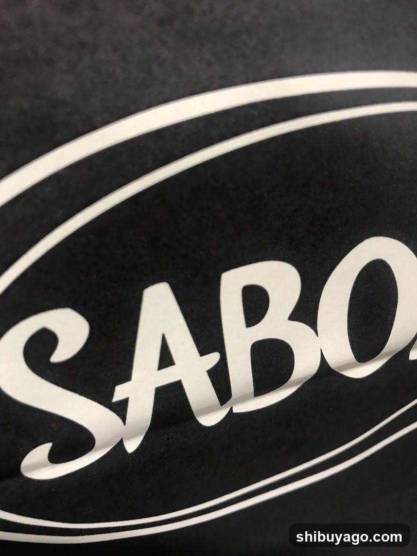 Sabon Logo on Black Fabric
