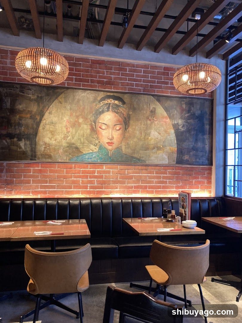 Interior of a restaurant with brick wall and artwork