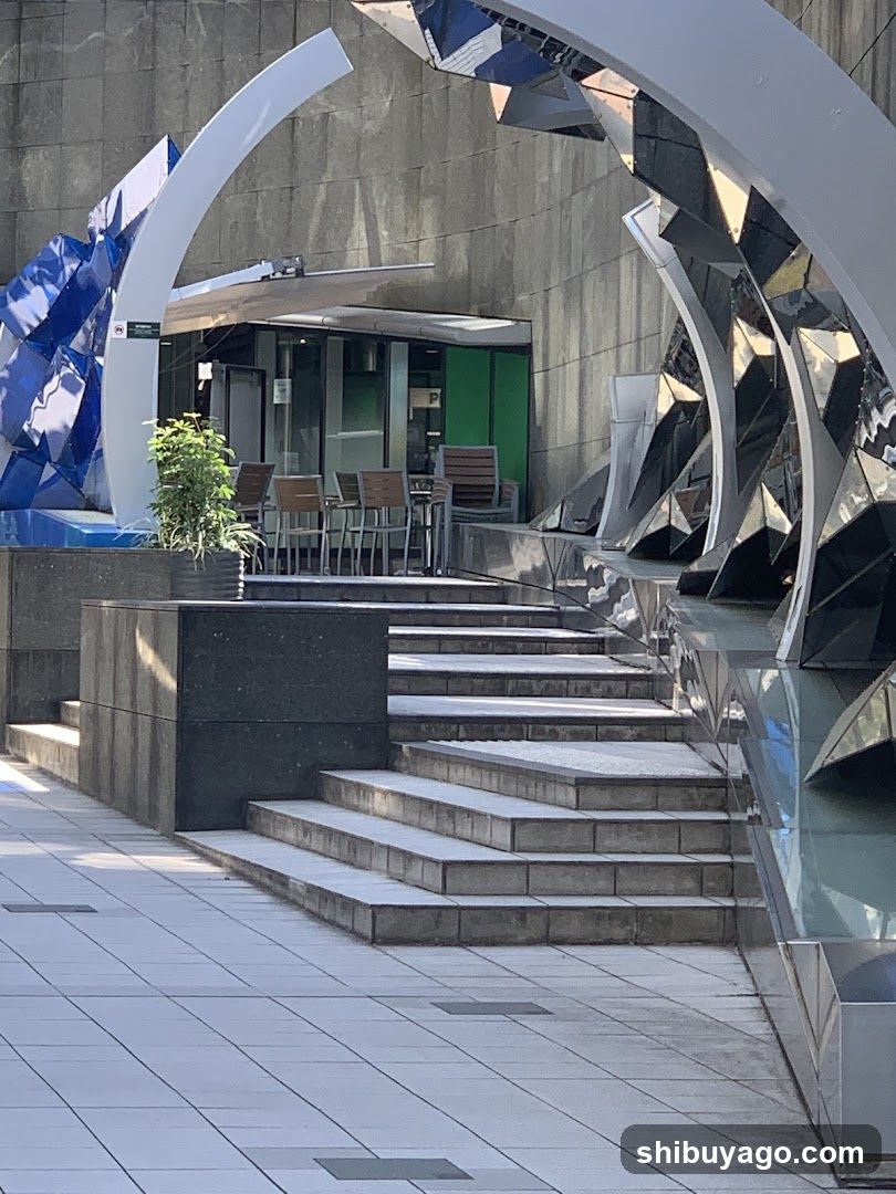 Modern Building Entrance with Artistic Sculptures