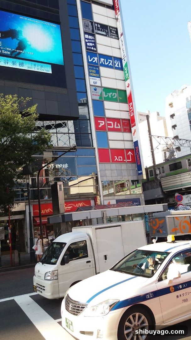 Urban Street Scene with Vehicles and Buildings