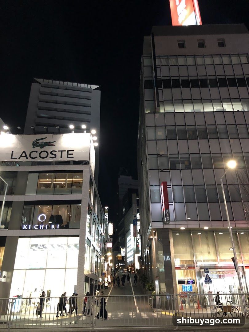 Night street scene with Lacoste store