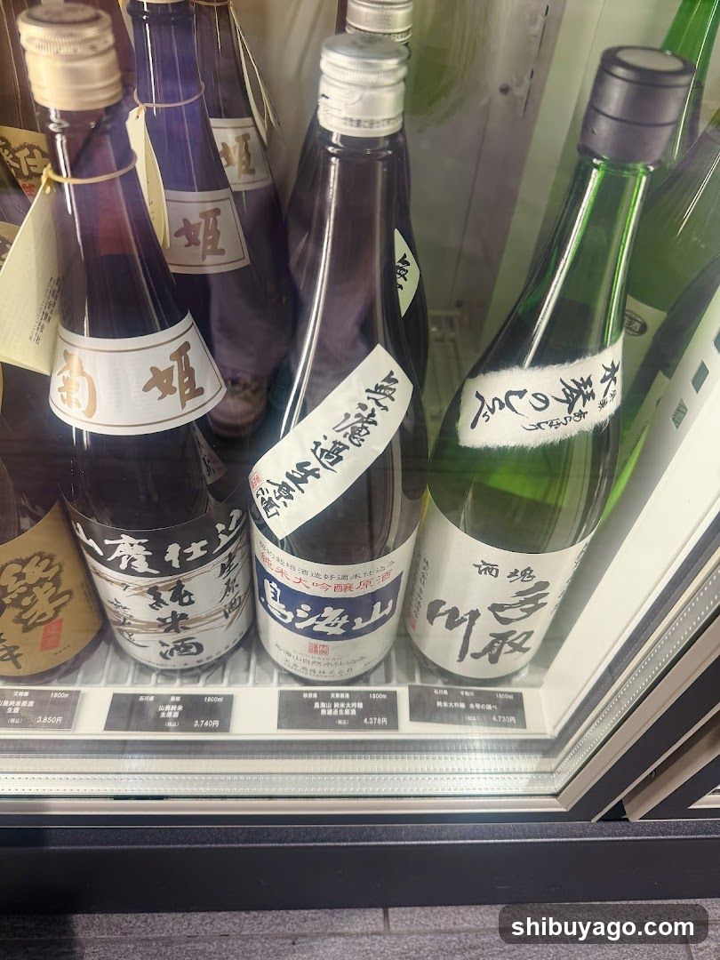 Sake bottles in a refrigerator display case