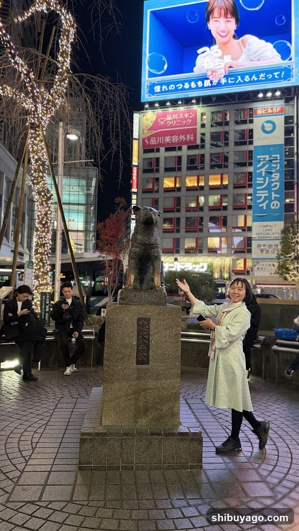 Night scene with statue and illuminated building