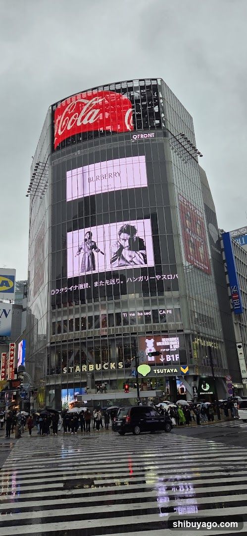 Coca-Cola Building Exterior with Multiple Advertisements