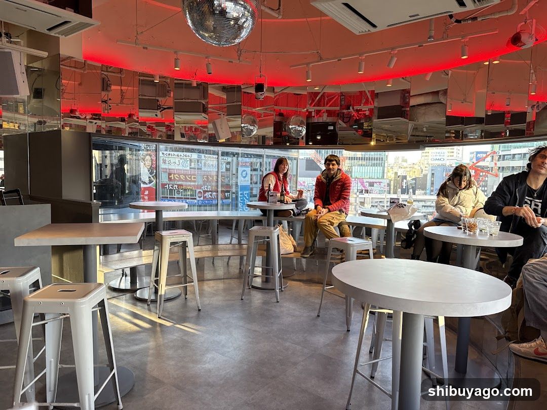 Interior of a modern cafe with disco ball and red lighting