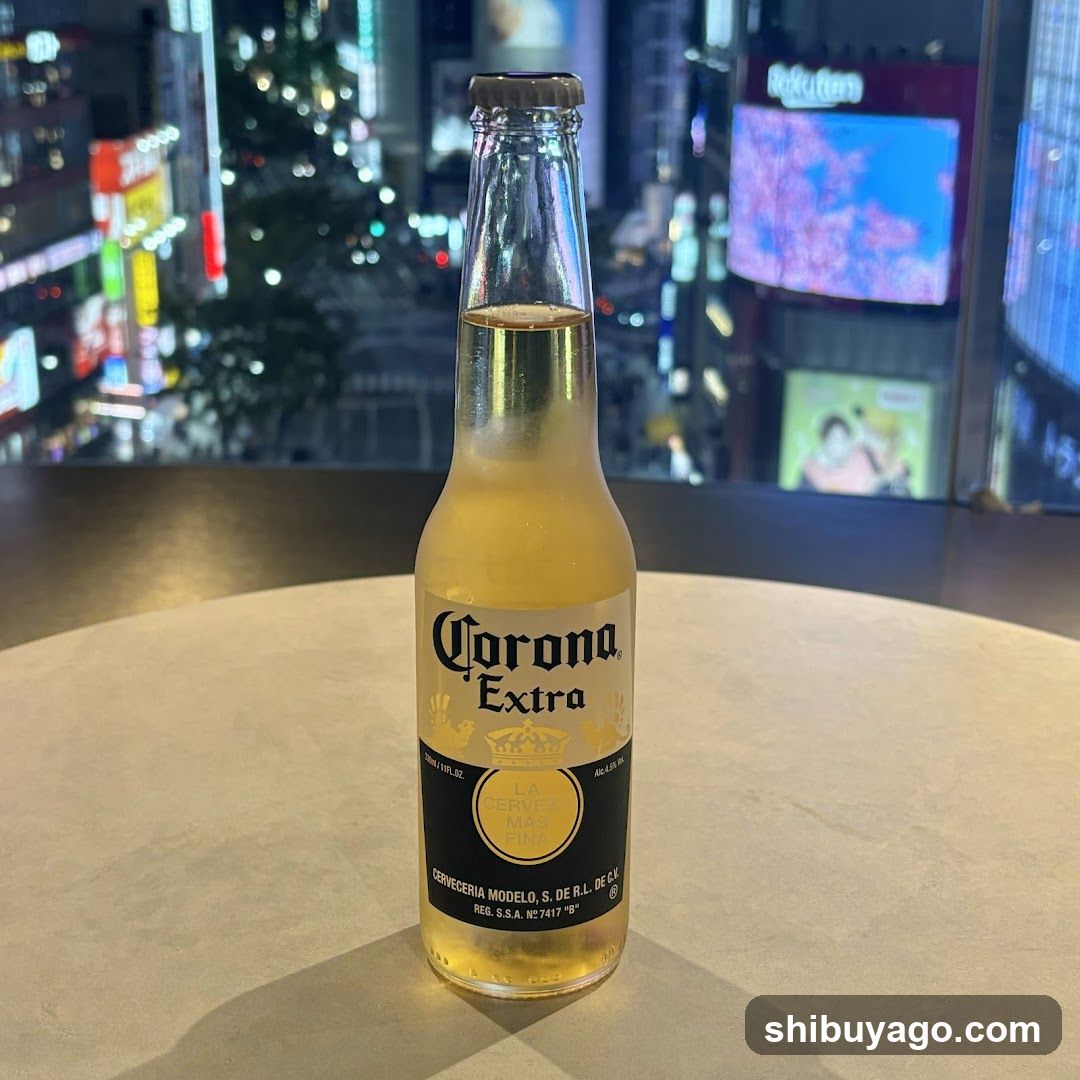 Corona Extra bottle on table with city lights in background