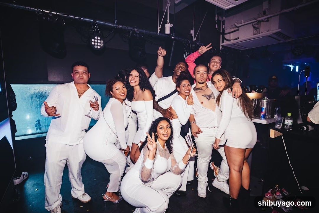 Group of people in white outfits at a party or event