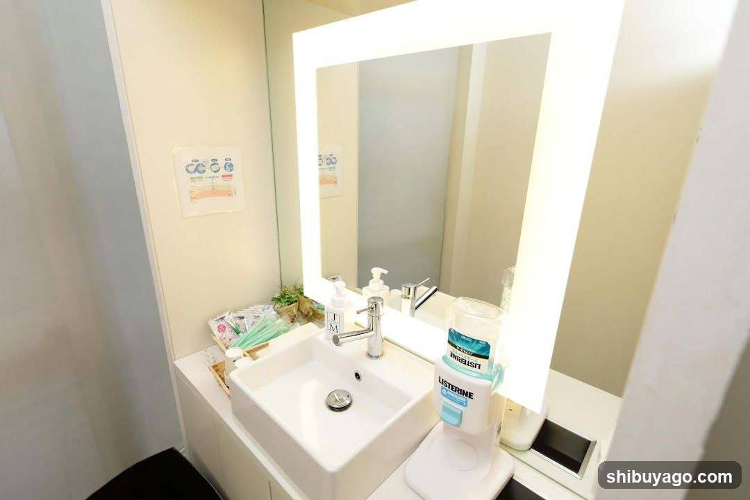 Bathroom Sink Area with Listerine Dispenser