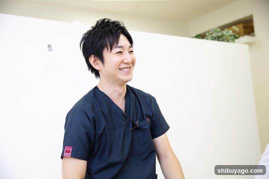 Smiling Staff Member in Medical Scrubs