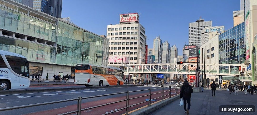 Urban Street Scene with Buses and Pedestrians