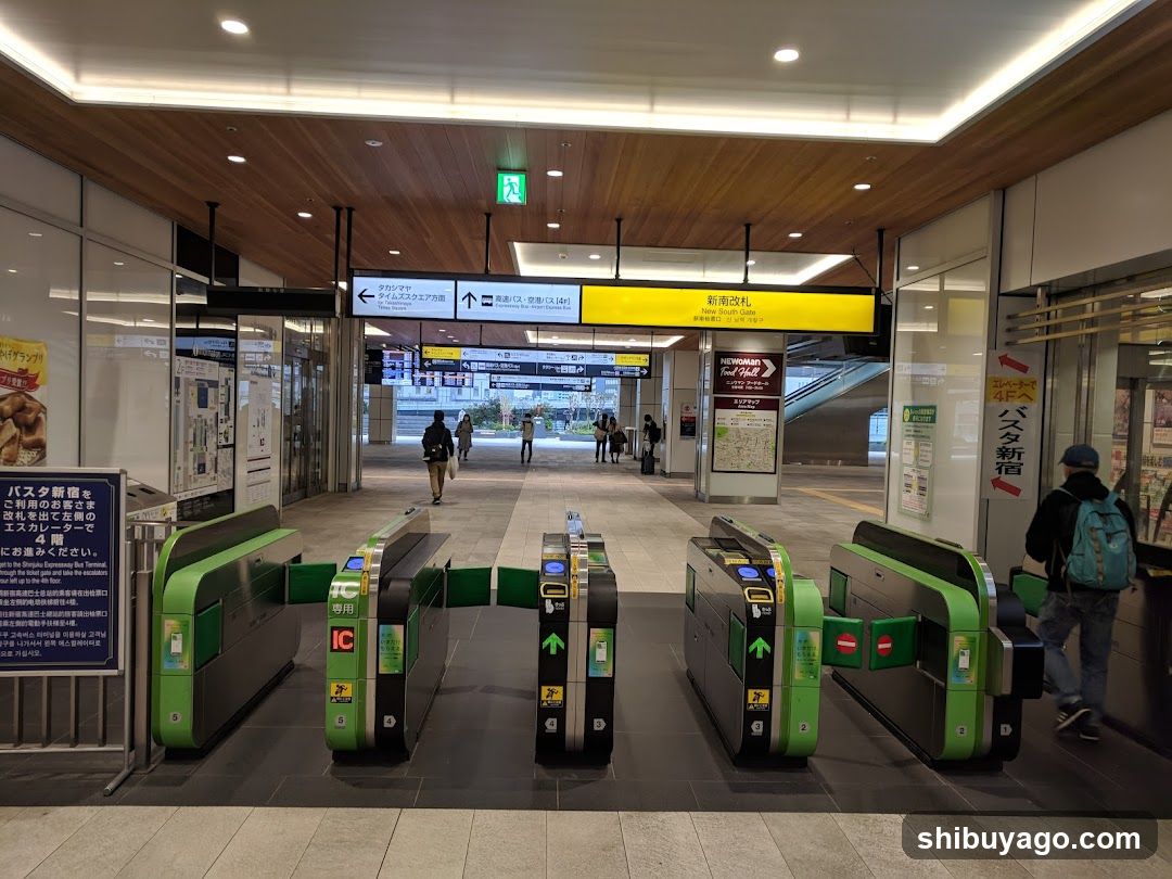 Station Entrance with Turnstiles and Signage