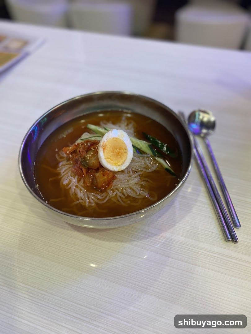 Bowl of Korean-style noodles with egg and vegetables