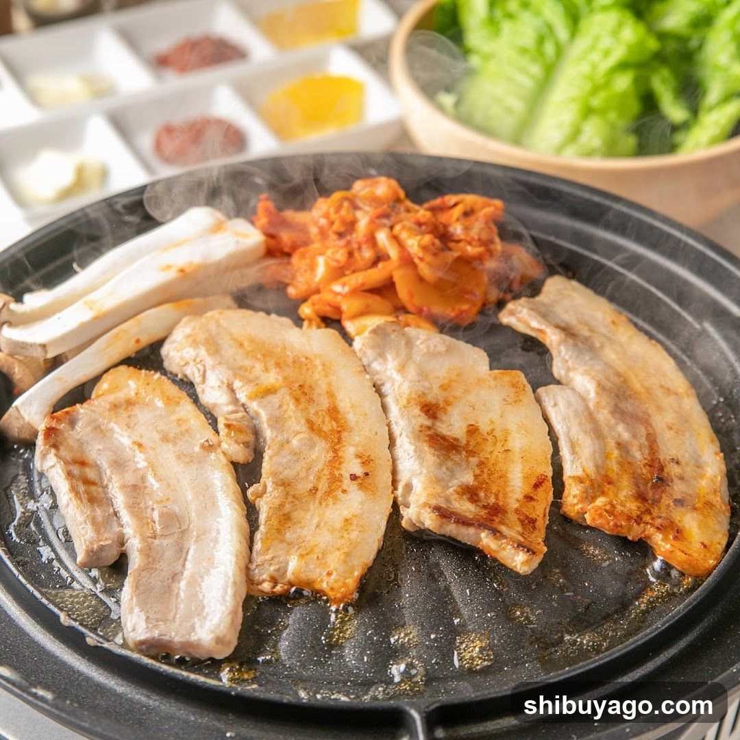Grilled Pork Belly with Kimchi and Side Dishes