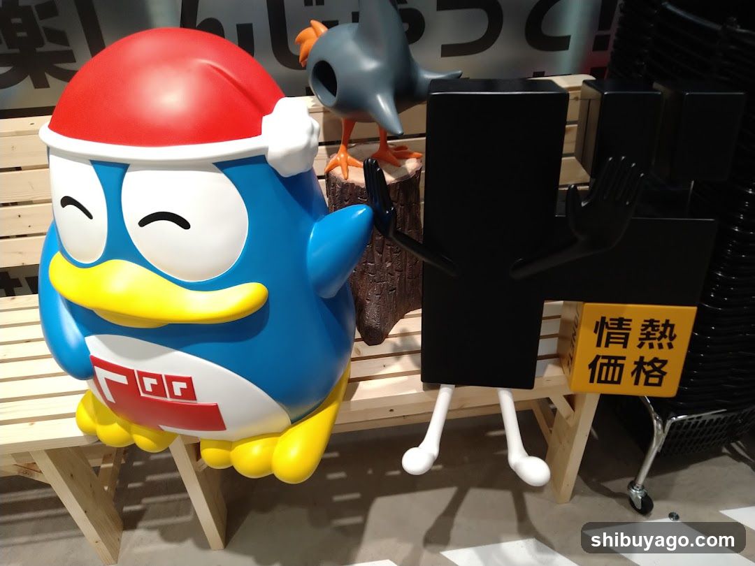 Merchandise Display with Penguin and Black Figure