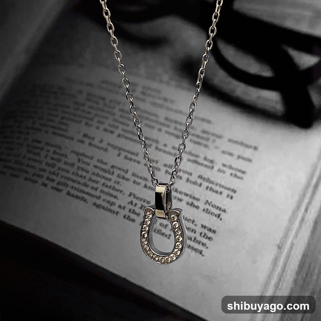 Horseshoe Pendant Necklace on Open Book