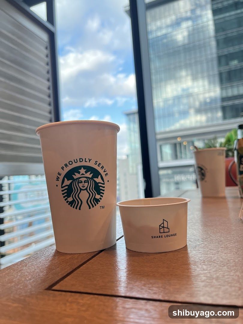 Starbucks and Share Lounge cups on table
