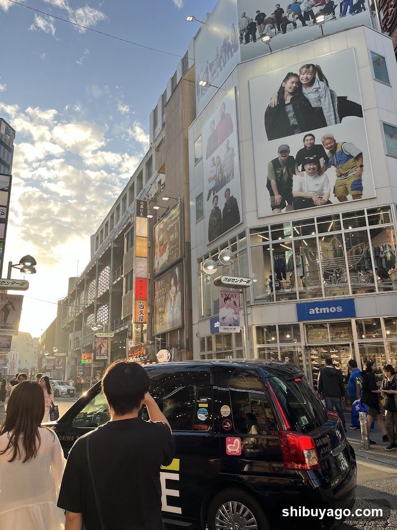 Urban Street Scene with Storefronts and Pedestrians