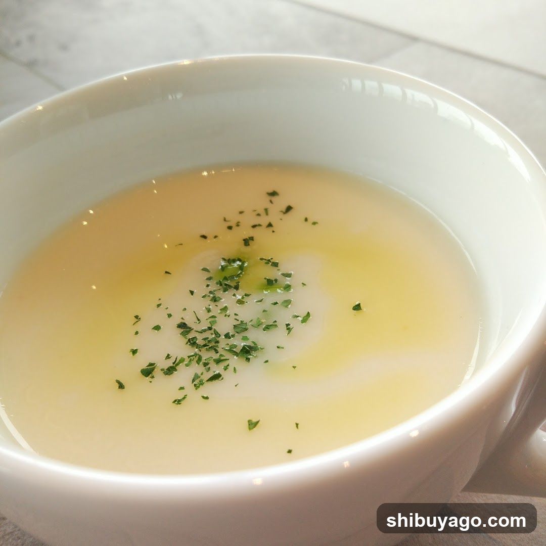 Bowl of Creamy Soup with Parsley Garnish