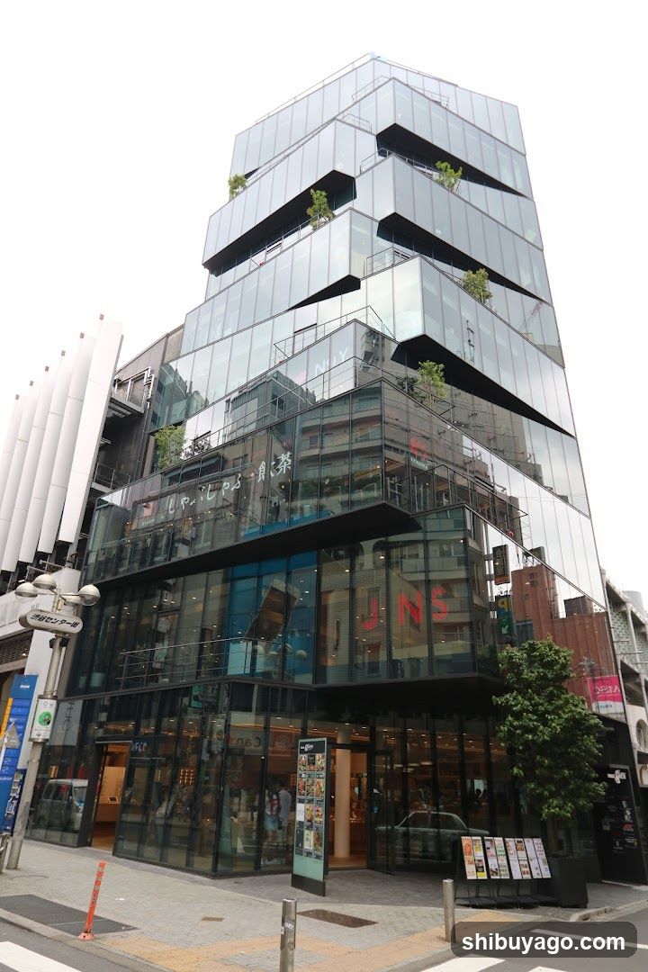 Modern glass building with storefronts