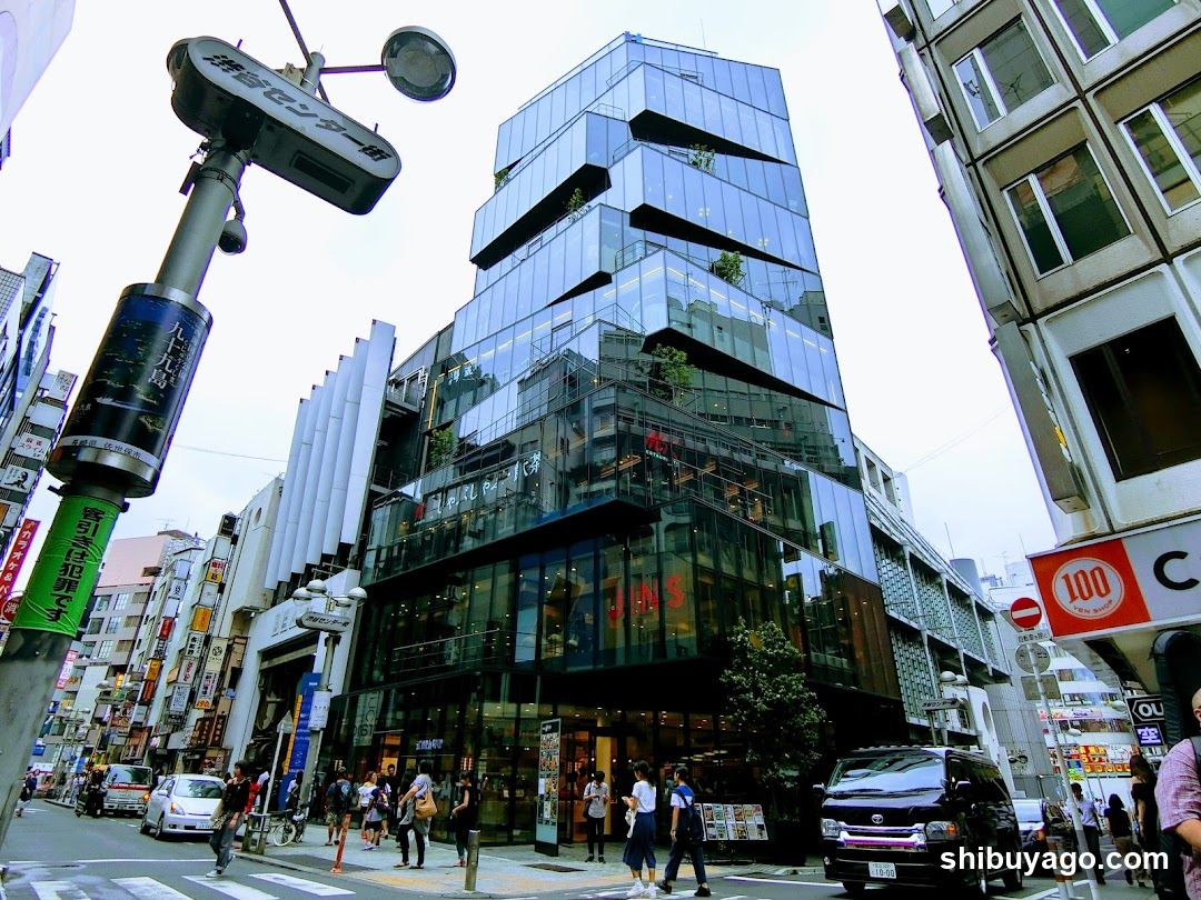 Urban Street Scene with Modern Glass Building