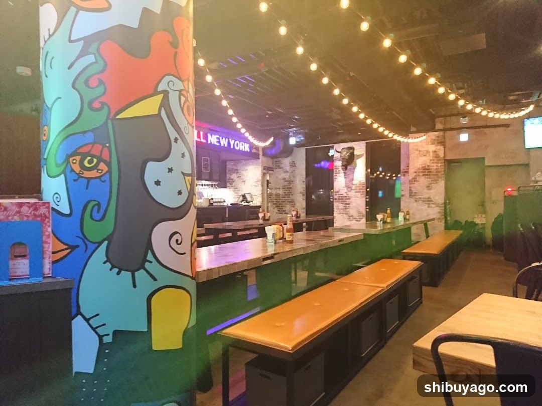 Interior of a bar or restaurant with colorful mural and string lights