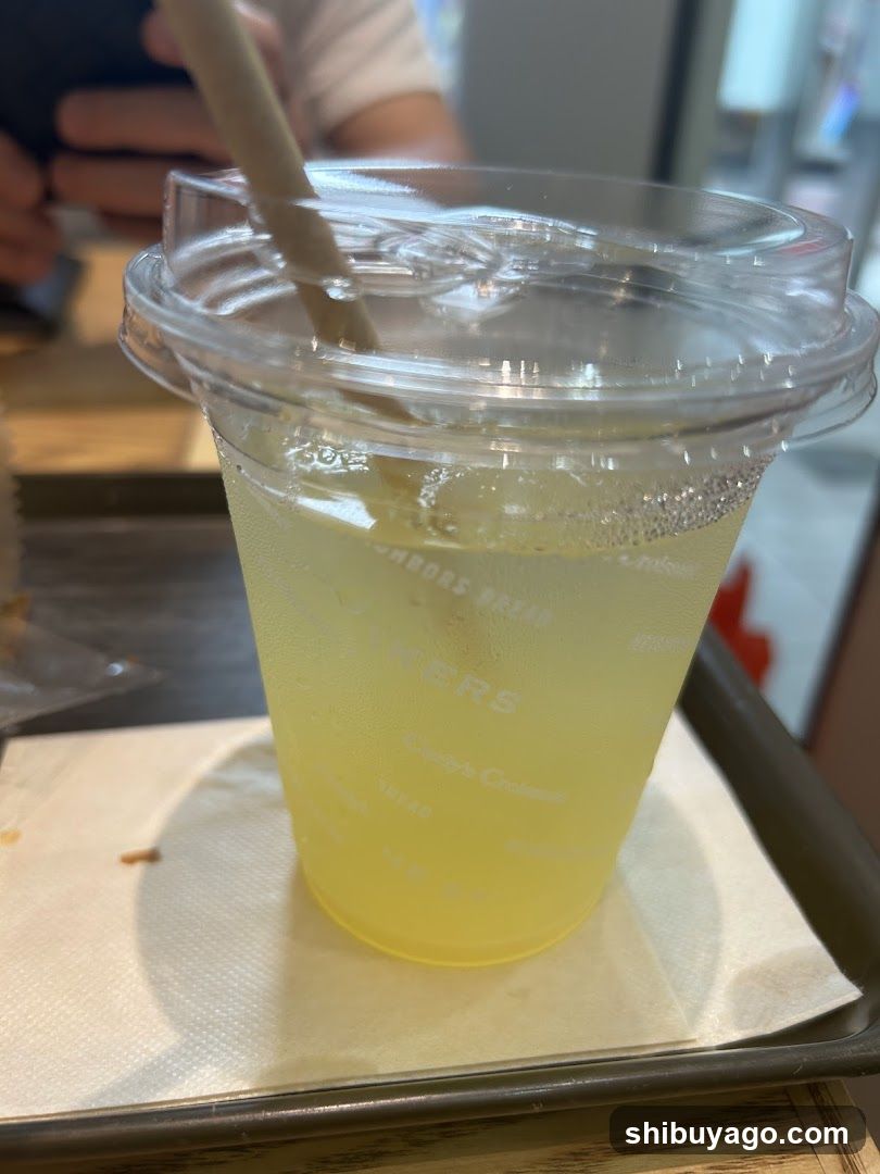 Yellow Iced Drink in Plastic Cup