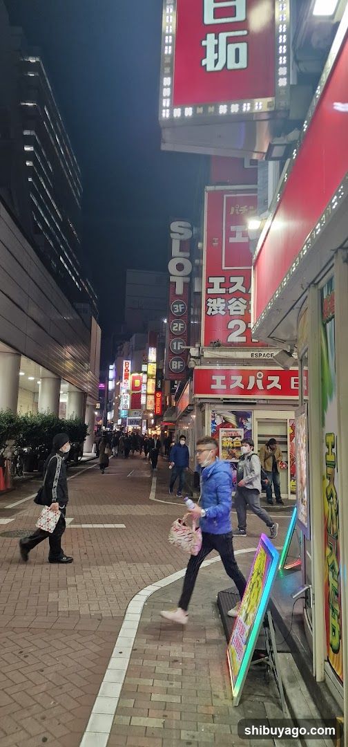 Night street scene with illuminated signs