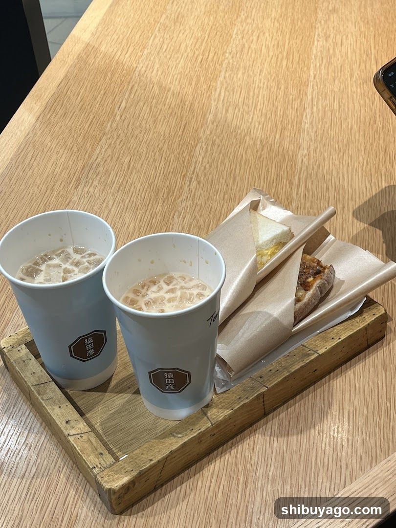 Beverages and Sandwich on Wooden Tray