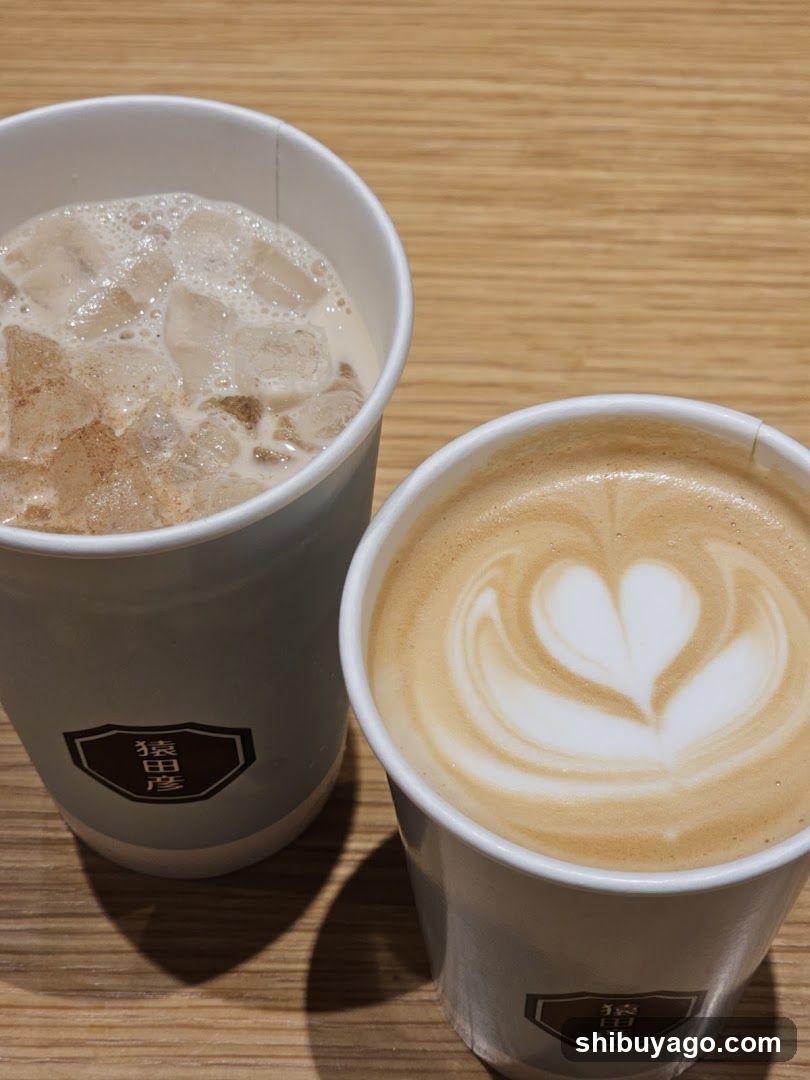 Two coffee cups on wooden table