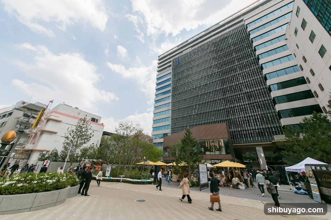 Urban plaza with modern buildings and pedestrians