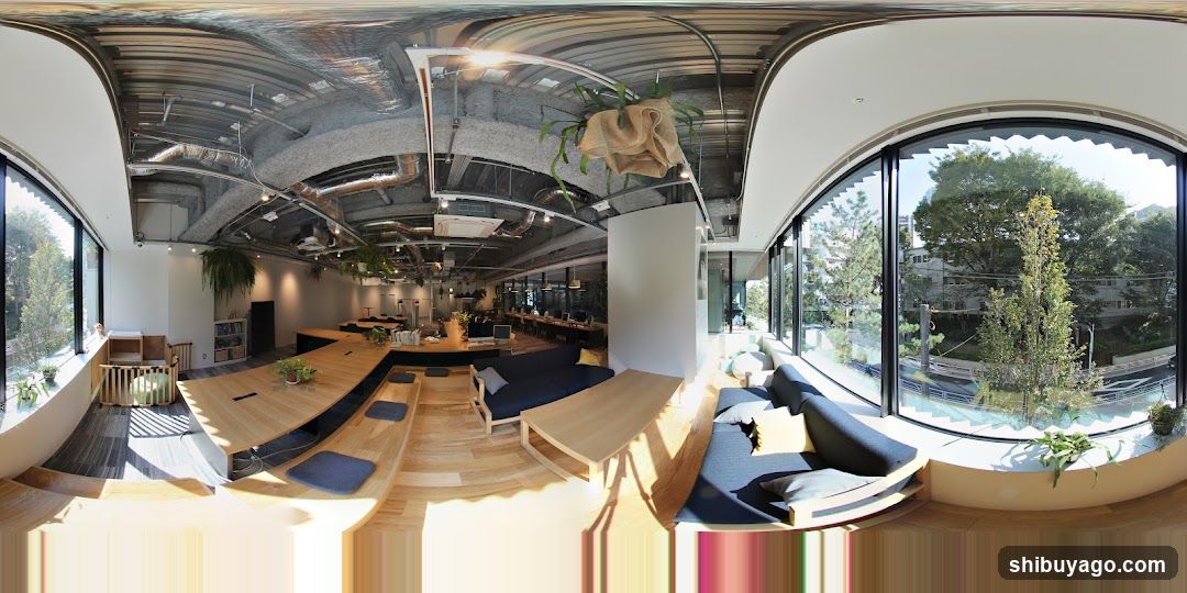 Modern Office Interior with Large Windows and Greenery
