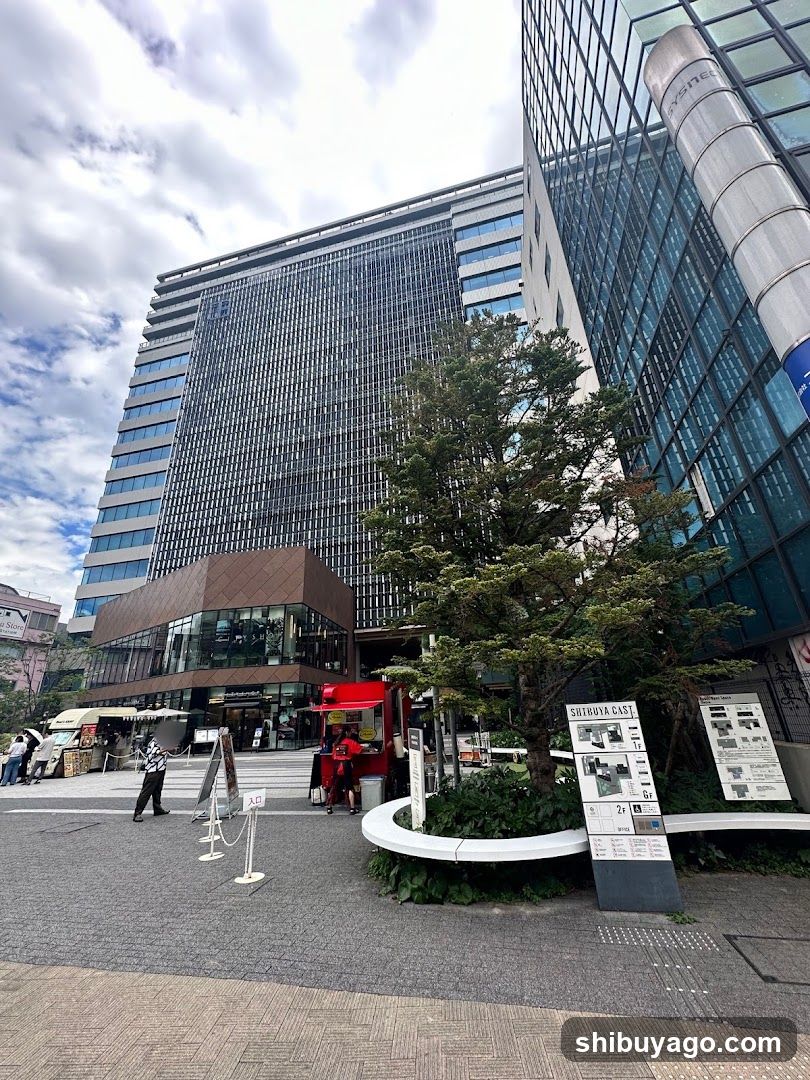 Urban plaza with food stalls and modern buildings