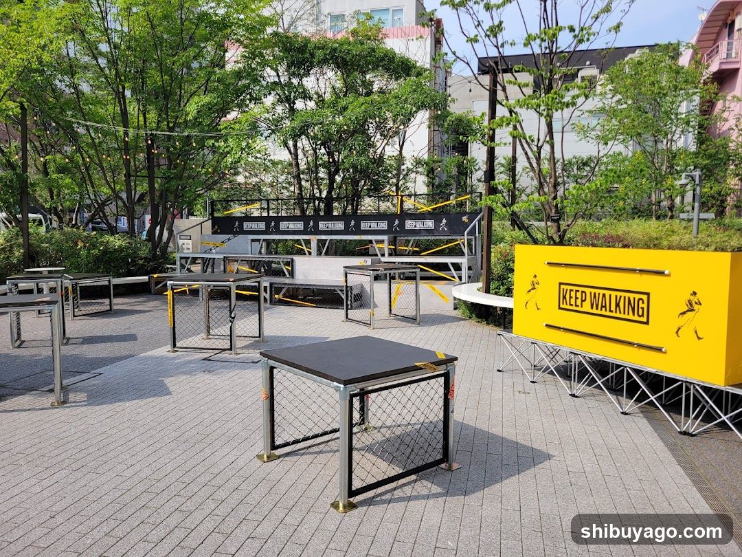 Outdoor Event Setup with 'Keep Walking' Sign